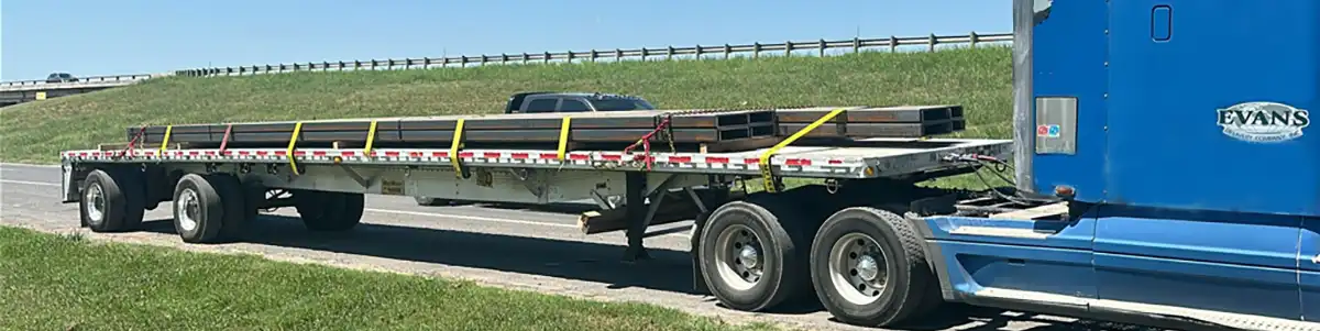 Evans Delivery Dallas Flatbed trailer and tractor out for delivery