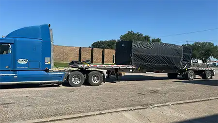 Evans Delivery Dallas Flatbed trailer with tarped load