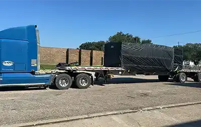 Evans Delivery Dallas Flatbed trailer with tarped load
