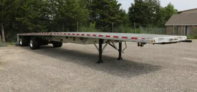 Evans Delivery Dallas flatbed trailer in yard
