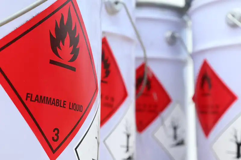 Flammable liquid HAZMAT placards on shipping containers