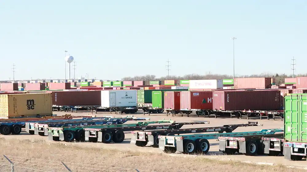 Intermodal containers and chassis staged in a storage yard